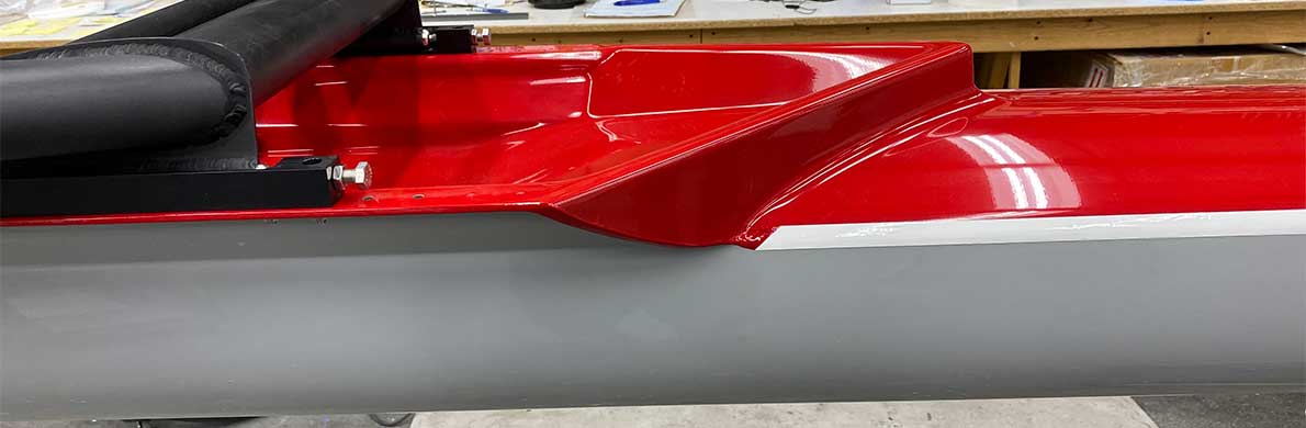 Grey hull red deck, contrasting white stripe